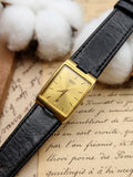 Vintage Seiko Gold-Tone Rectangular Tank Watch – Champagne Sunburst Date Dial & Black Leather Strap Edition