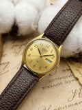 Vintage Seiko SQ Gold-Tone Day-Date Watch – Champagne Dial & Textured Brown Leather Strap Edition