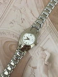 1990s–2000s Vintage Relic Silver-Tone Oval Dress Watch – White Roman Numeral Dial & Tapered Link Bracelet Edition