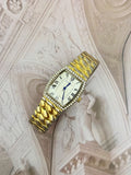 Vintage Isaac Mizrahi Live! Gold-Tone Tonneau Crystal Watch – Roman Numeral Dial & Scale Bracelet Edition