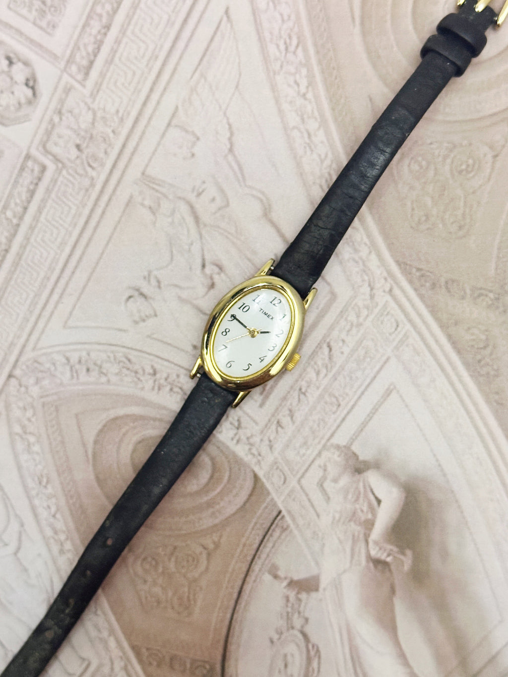 Vintage Timex Gold-Tone Oval Ladies Watch – White Dial & Black Leather Strap Edition