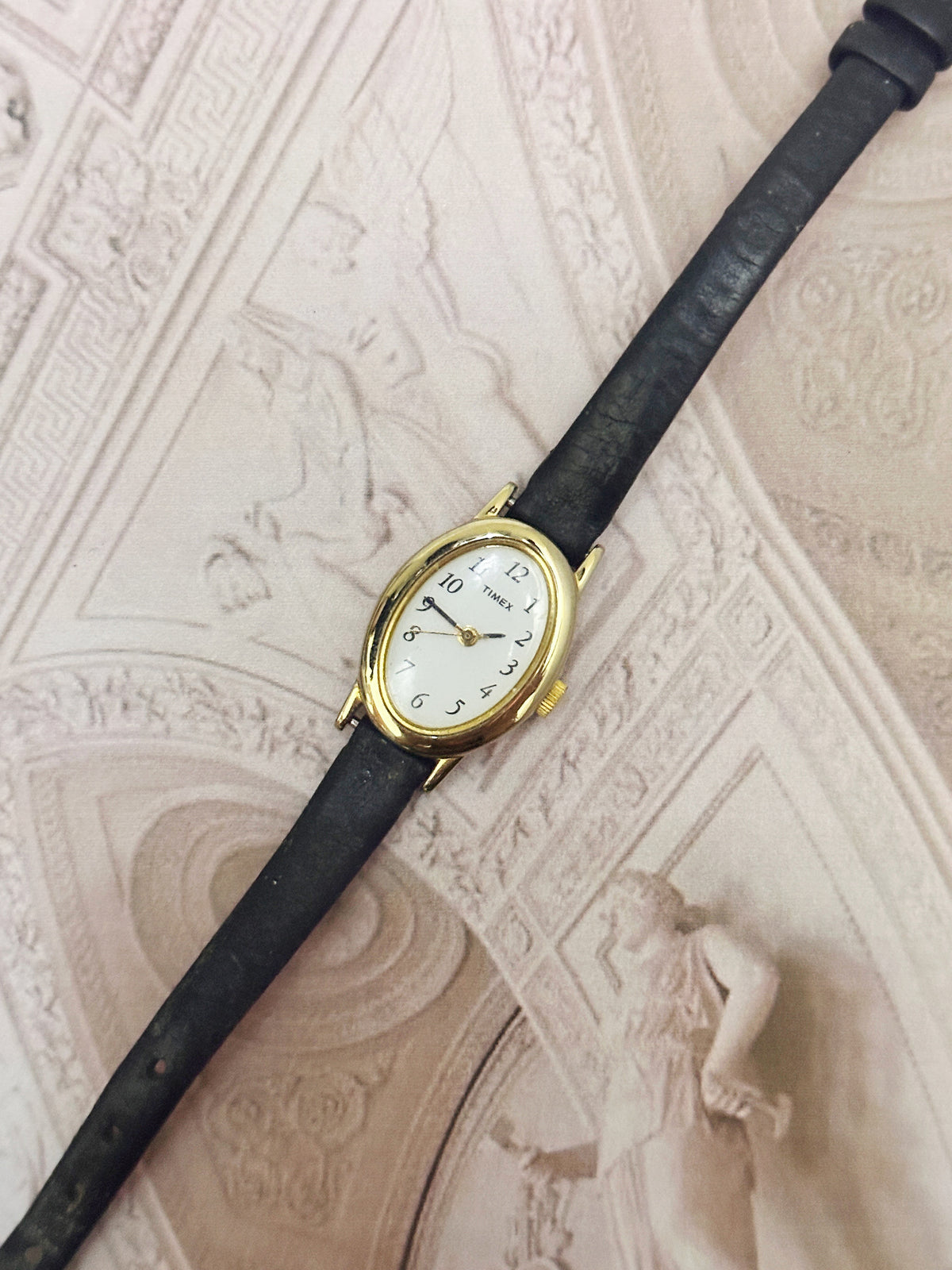 Vintage Timex Gold-Tone Oval Ladies Watch – White Dial & Black Leather Strap Edition