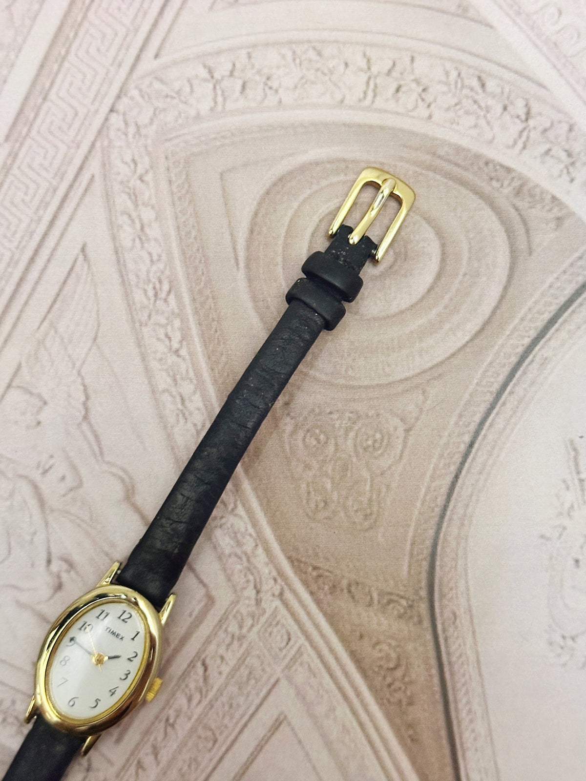 Vintage Timex Gold-Tone Oval Ladies Watch – White Dial & Black Leather Strap Edition