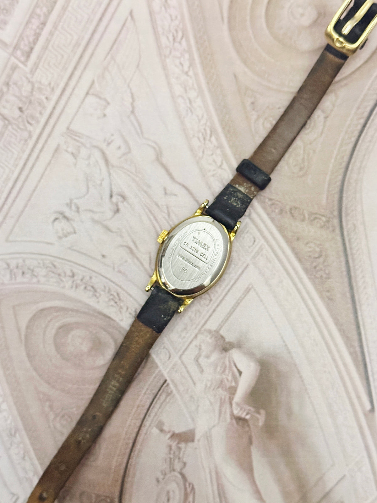 Vintage Timex Gold-Tone Oval Ladies Watch – White Dial & Black Leather Strap Edition